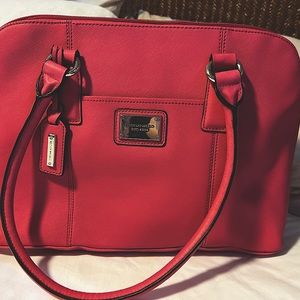 Tignello pink satchel with Bright stripes colors inside gently used